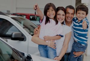 Happy family just after purchasing a new car